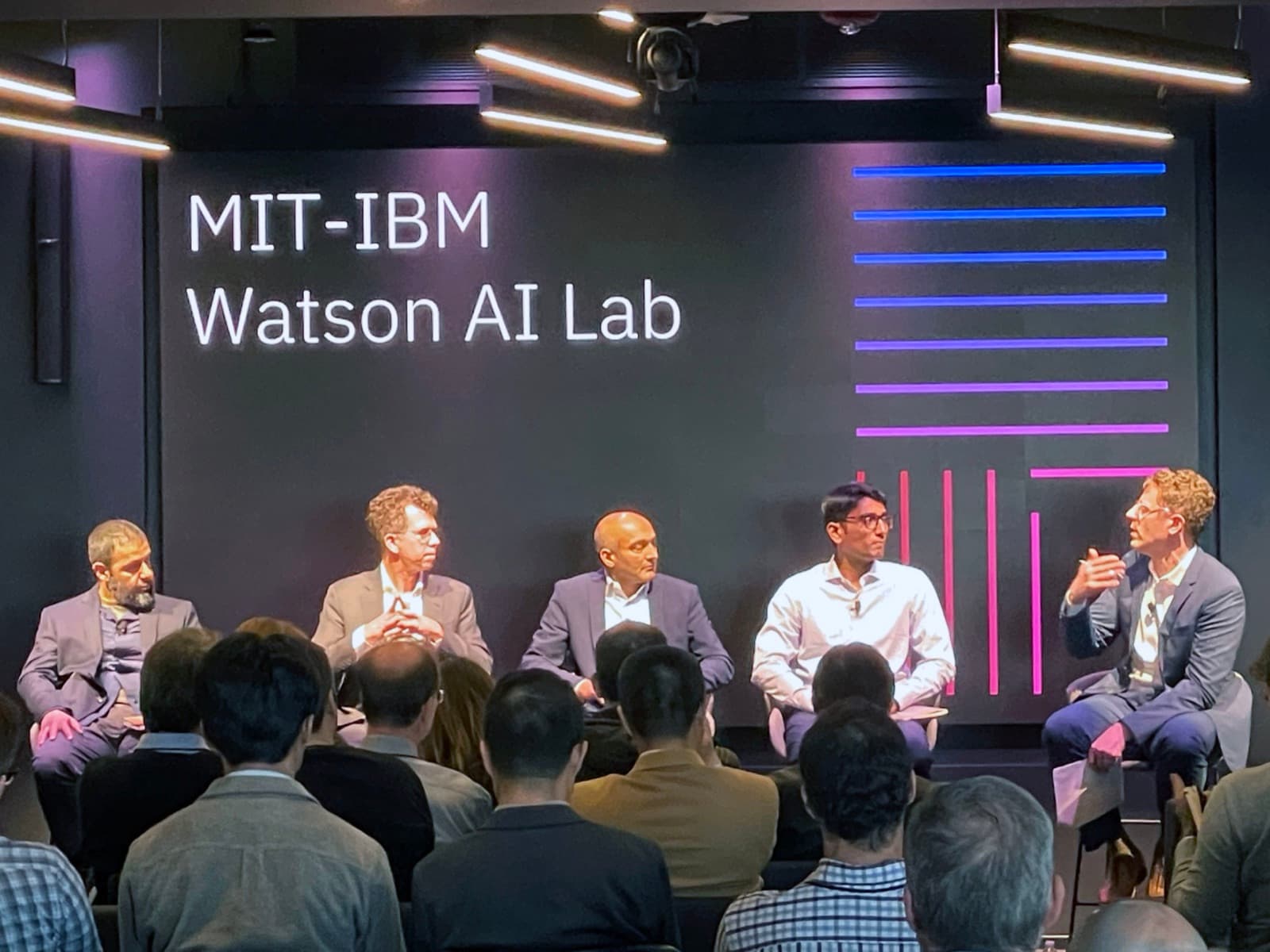 A panel on stage at the MIT-IBM Watson AI Lab